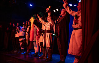 Martin Blais visible in a stage photo from La Guerre des Cônes at Fringe 2025, view 9
