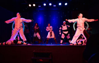 Martin Blais visible in a stage photo from La Guerre des Cônes at Fringe 2025, view 3