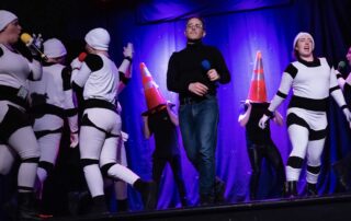 Martin Blais visible in a stage photo from La Guerre des Cônes at Fringe 2025, view 4