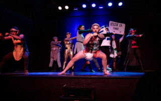 Martin Blais visible in a stage photo from La Guerre des Cônes at Fringe 2025, view 19
