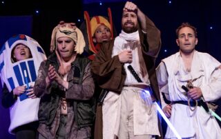 Martin Blais visible in a stage photo from La Guerre des Cônes at Fringe 2025, view 1